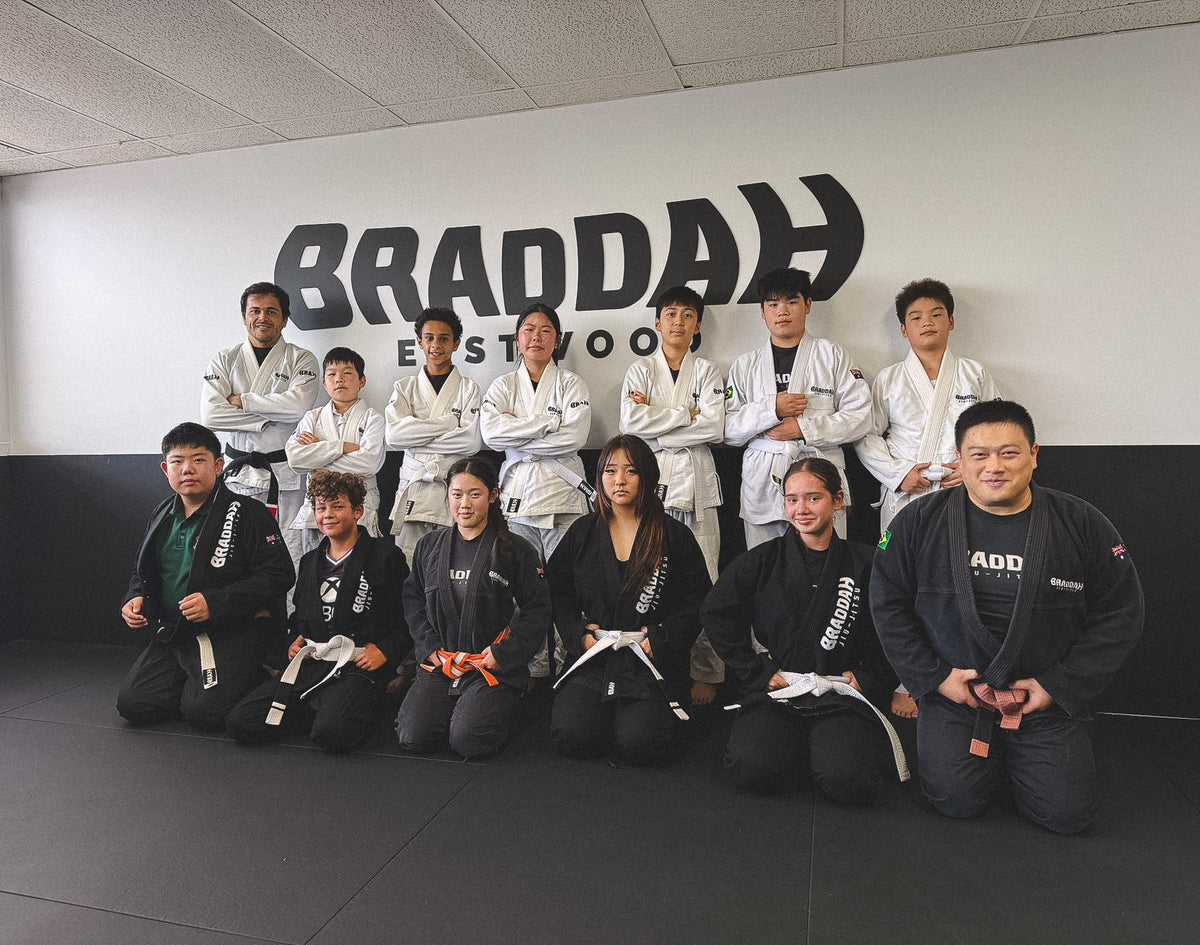 Braddah Jiu-Jitsu Eastwood students and coaches posing together in Brazilian Jiu-Jitsu uniforms