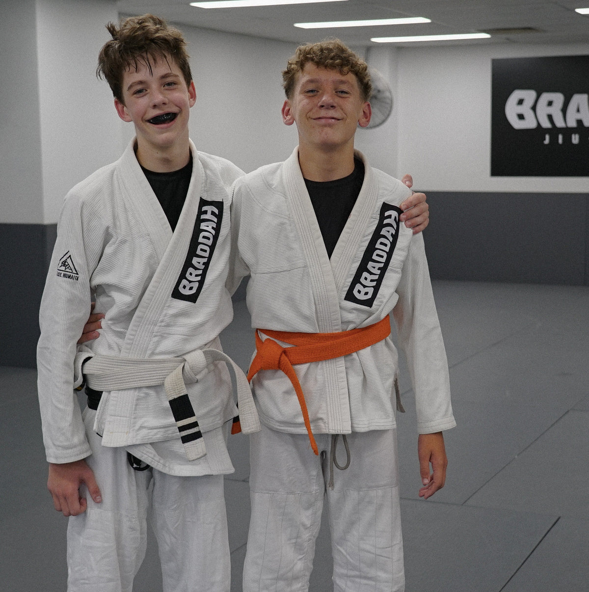 Braddah Jiu-Jitsu young students posing together in their Brazilian Jiu-Jitsu uniforms