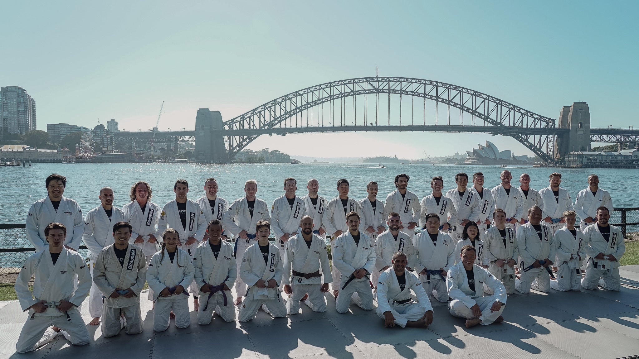 Braddah Jiu-Jitsu team posing in Sydney with the Harbour Bridge and Opera House
