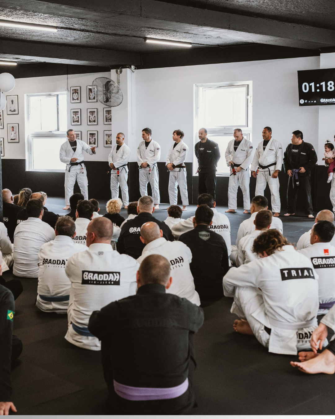 Braddah Jiu-Jitsu students watching instructors during a Brazilian Jiu-Jitsu training seminar