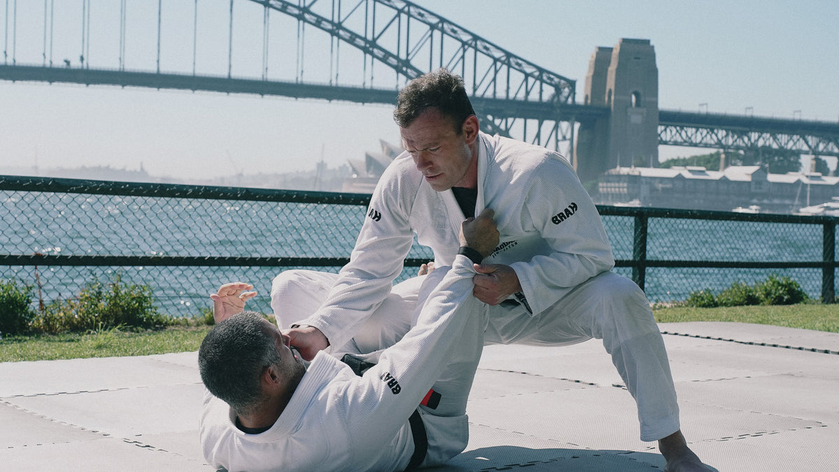 Braddah Jiu-Jitsu athletes practicing Brazilian Jiu-Jitsu techniques outdoors